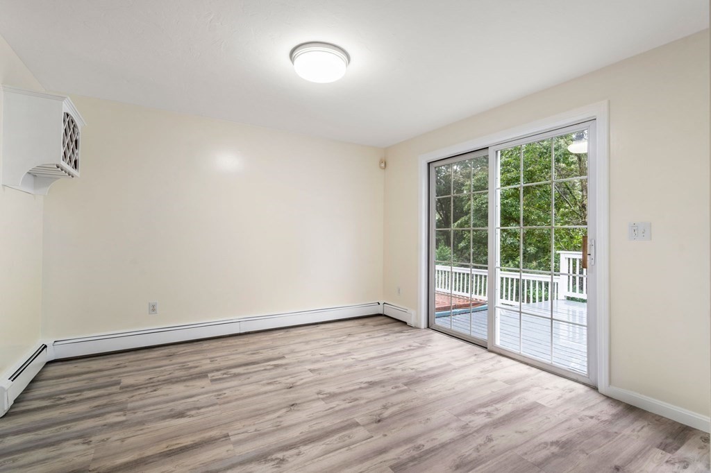 98 Allen Street Walpole, MA 02081 - Photo 12 of 37 wooden floor in an empty room with a window