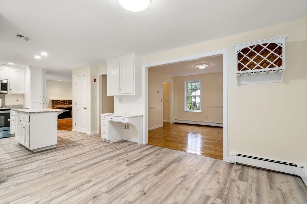 98 Allen Street Walpole, MA 02081 - Photo 13 of 37 a kitchen with a refrigerator and a stove top oven
