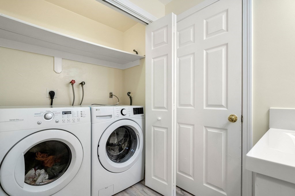 98 Allen Street Walpole, MA 02081 - Photo 17 of 37 a view of entryway with washer and dryer