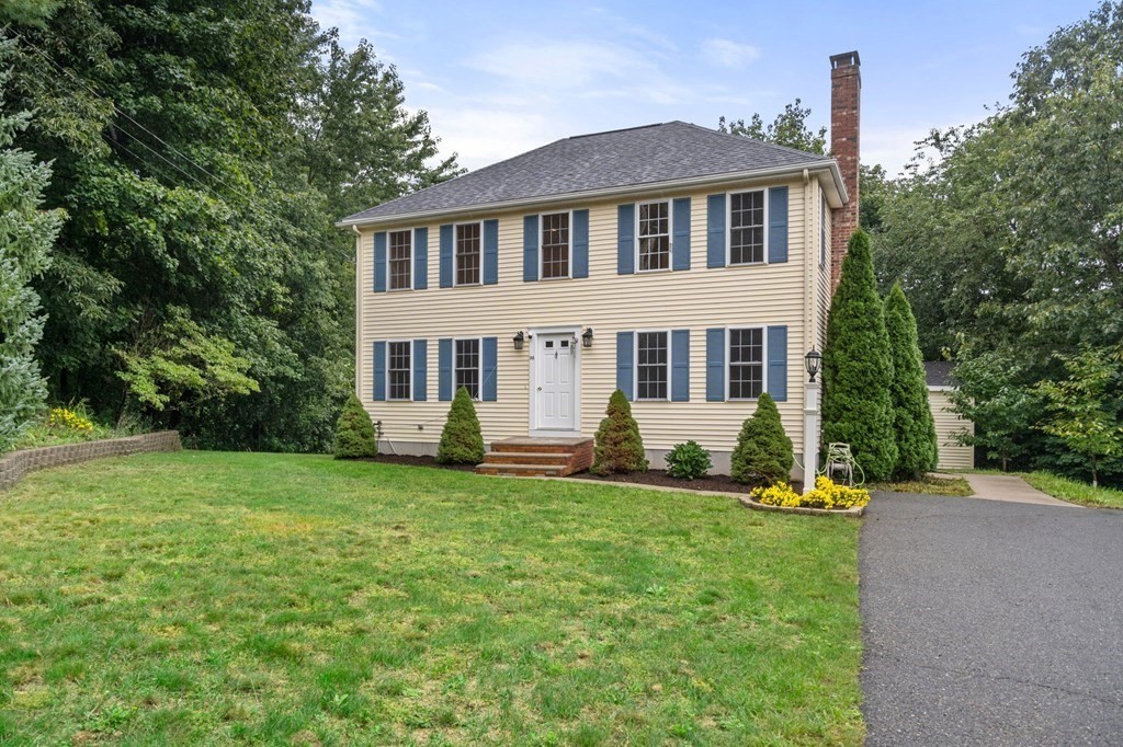 98 Allen Street Walpole, MA 02081 - Photo 2 of 37 a front view of a house with a yard