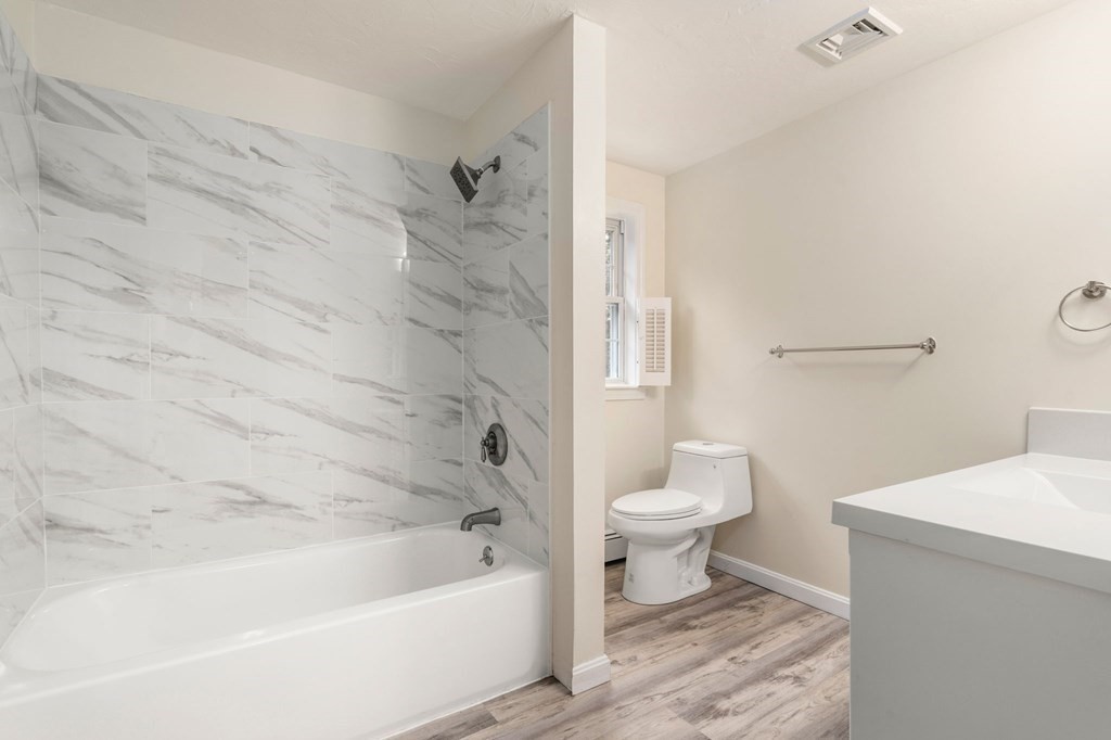98 Allen Street Walpole, MA 02081 - Photo 27 of 37 a bathroom with a sink a toilet and bathtub