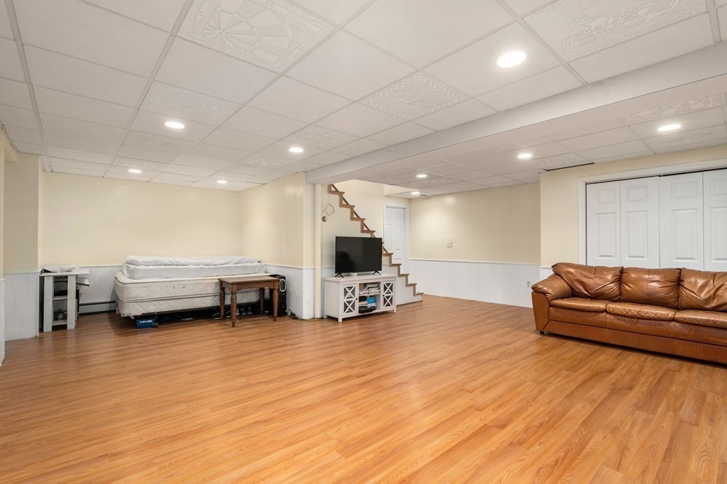 98 Allen Street Walpole, MA 02081 - Photo 29 of 37 a living room with furniture and a wooden floor