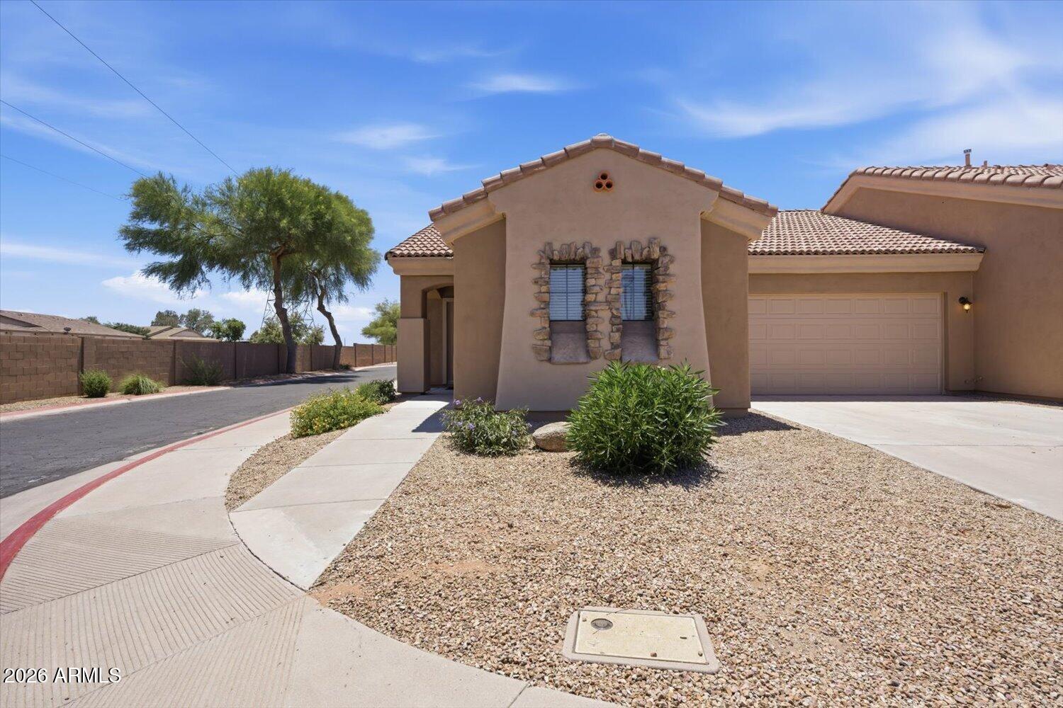 2565 South Signal Butte Road, Unit 23 Mesa, AZ 85209 - Photo 2 of 29 a front view of a house with a yard