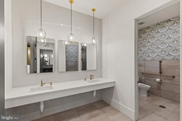 a view of a tall building with a yard