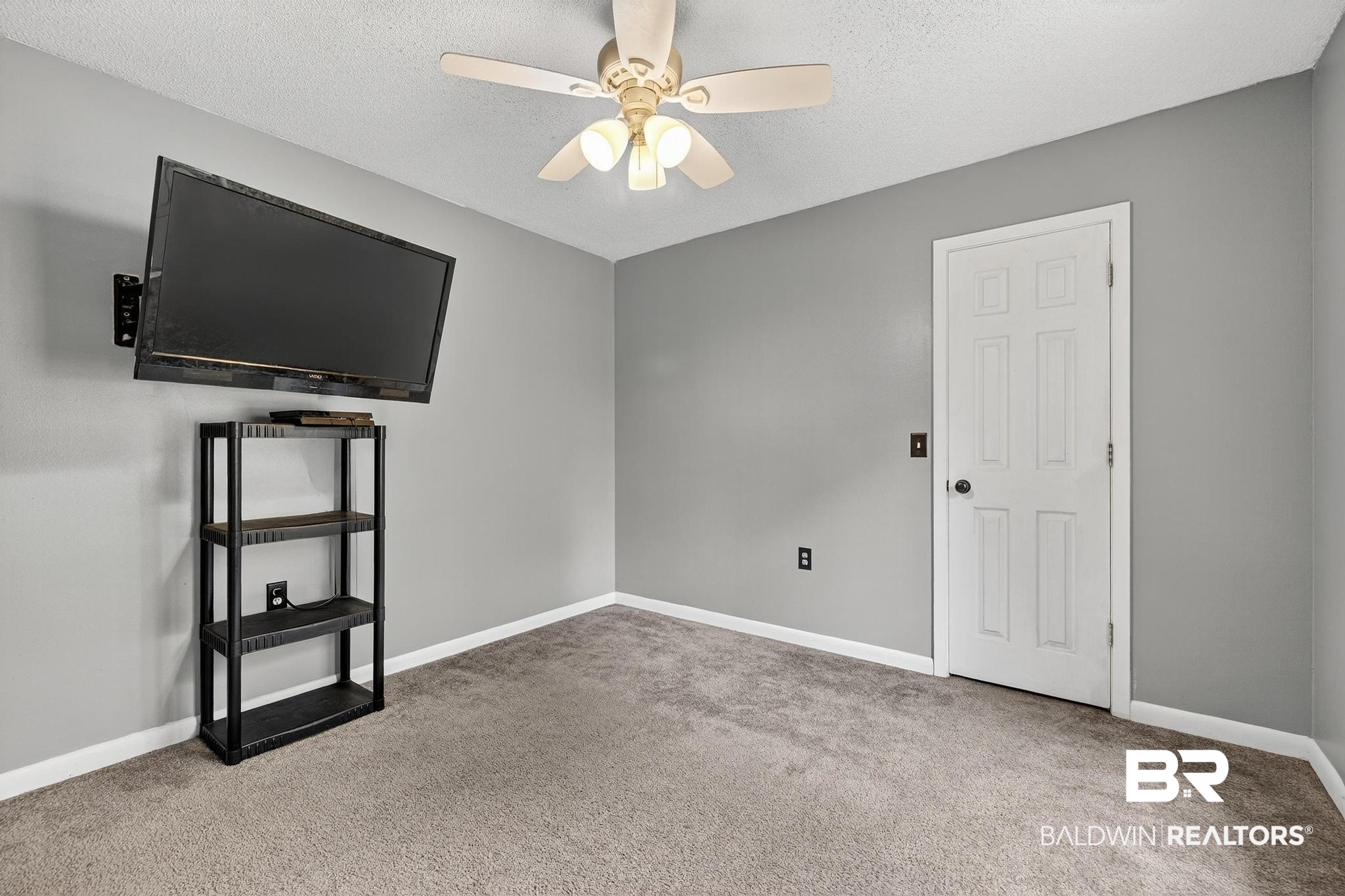 21895 2nd Street Silverhill, AL 36576 - Photo 34 of 43 Bedroom with light carpet and a ceiling fan
