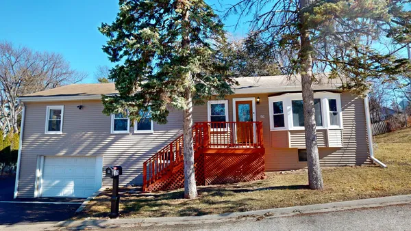 a view of house with a yard