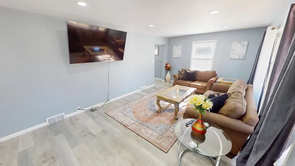 a living room with furniture and a window