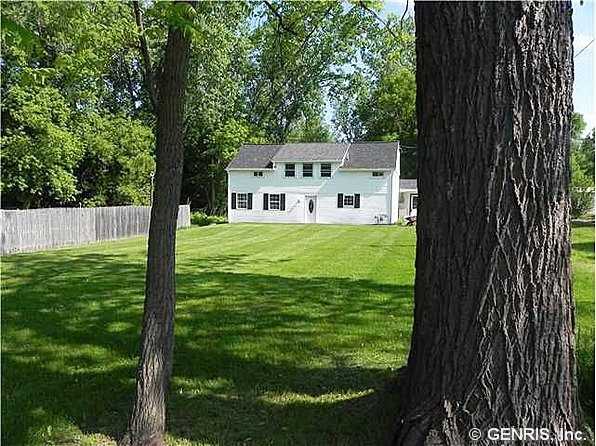 764 Whitney Road West Perinton, NY 14450 - Photo 1 of 1 Exterior Front Set way back from the road on 1 pri
