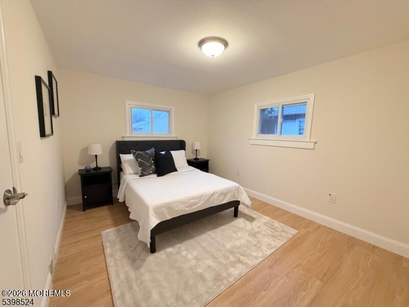 484 Bara Street Brick, NJ 08723 - Photo 10 of 15 a bedroom with a bed and night stand