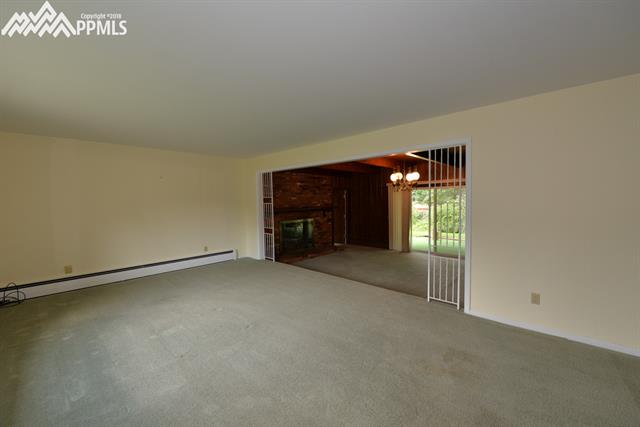 Huge living room looking thru dining room to covered patio