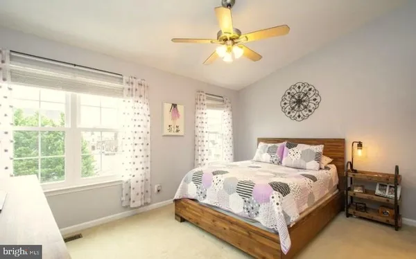 a bedroom with a bed and a table