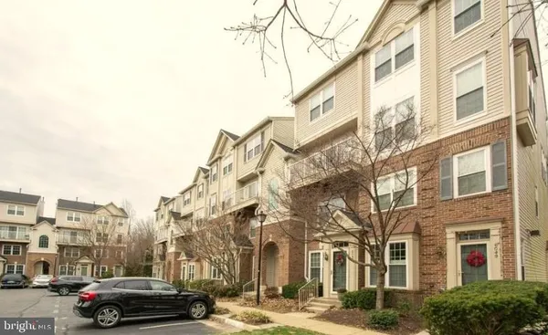 a city street lined with buildings and cars