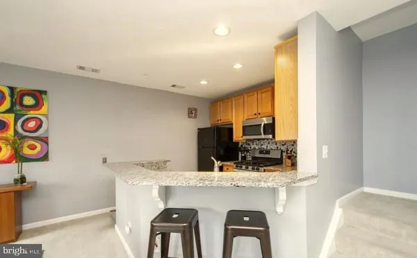 a view of living room with furniture and flat screen tv