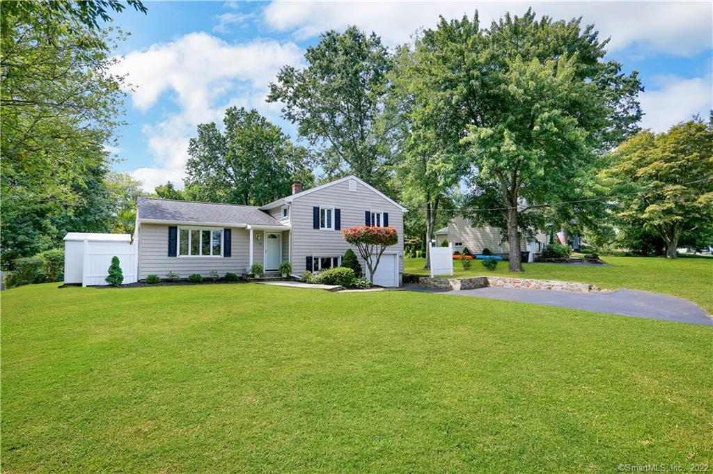 109 Farist Road Fairfield, CT 06825 - Photo 1 of 1 a front view of a house with garden