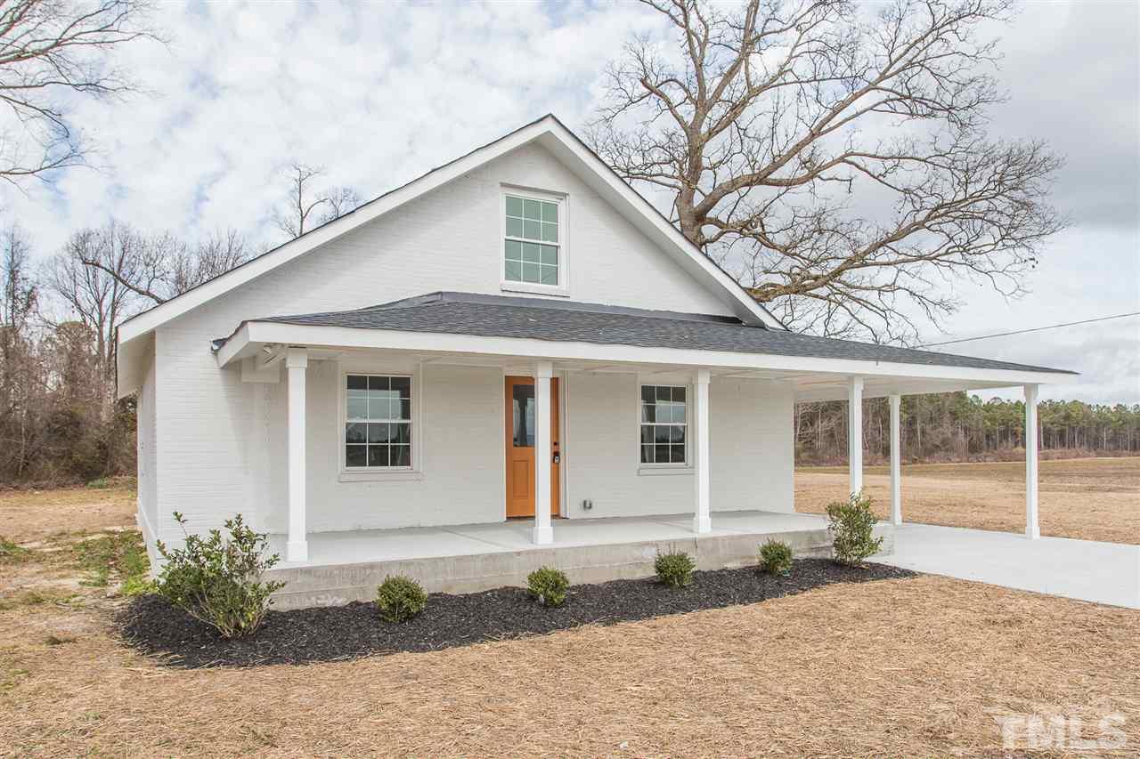 937 Wilson Road Clinton, NC 28328 - Photo 1 of 28 a front view of a house with garden