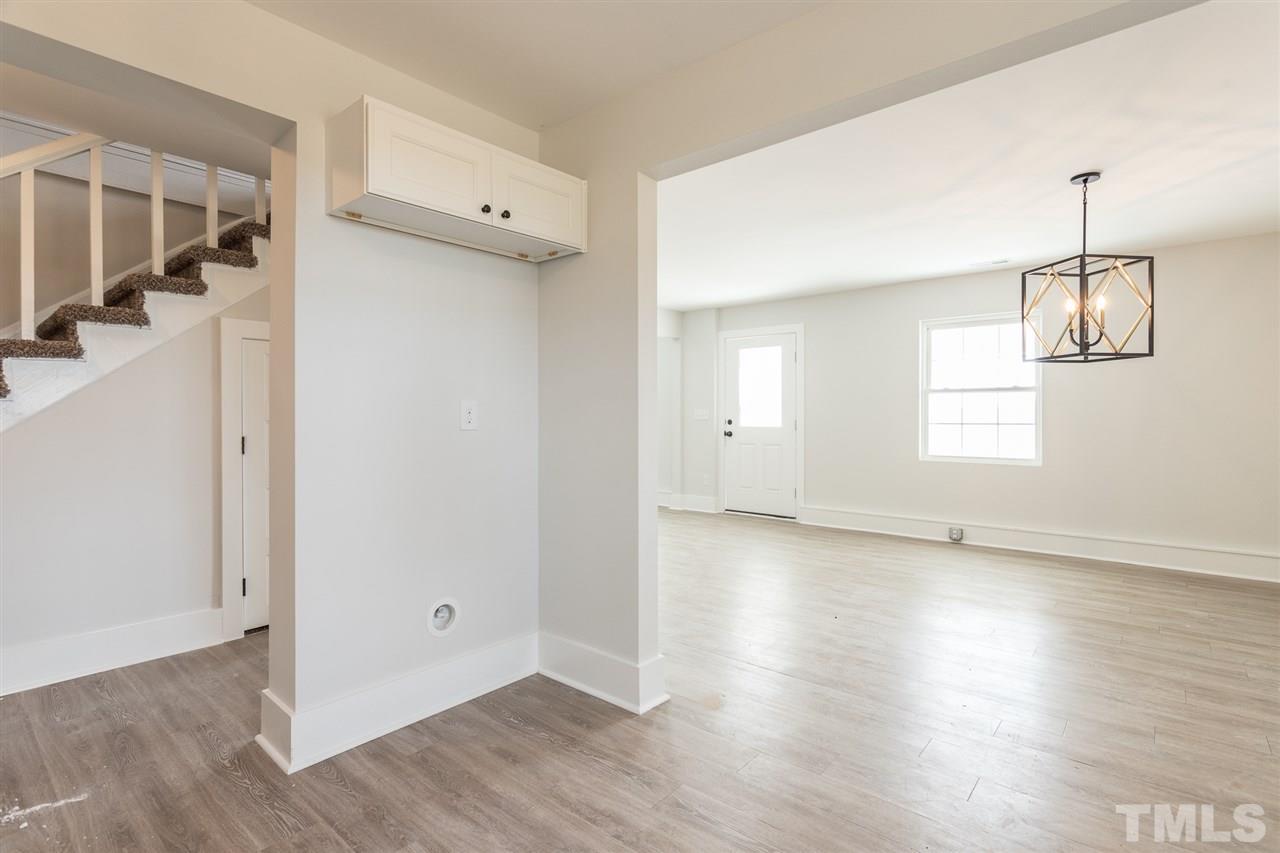 937 Wilson Road Clinton, NC 28328 - Photo 17 of 28 an empty room with wooden floor and windows
