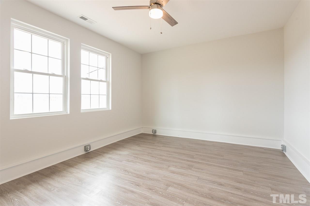 937 Wilson Road Clinton, NC 28328 - Photo 19 of 28 wooden floor in an empty room with a window