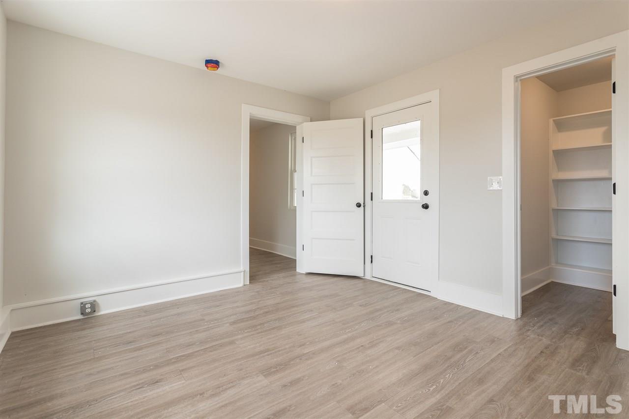 937 Wilson Road Clinton, NC 28328 - Photo 21 of 28 a view of an empty room with wooden floor