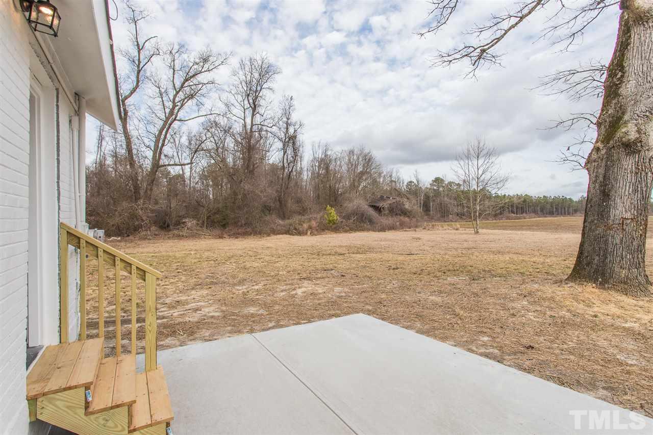 937 Wilson Road Clinton, NC 28328 - Photo 4 of 28 a view of a yard with an outdoor space