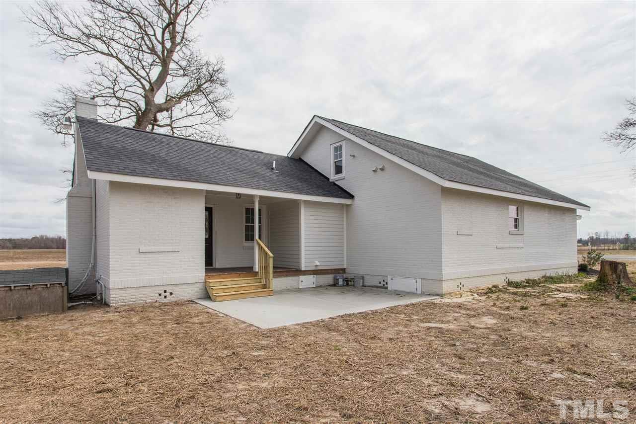 937 Wilson Road Clinton, NC 28328 - Photo 6 of 28 a house with trees in the background