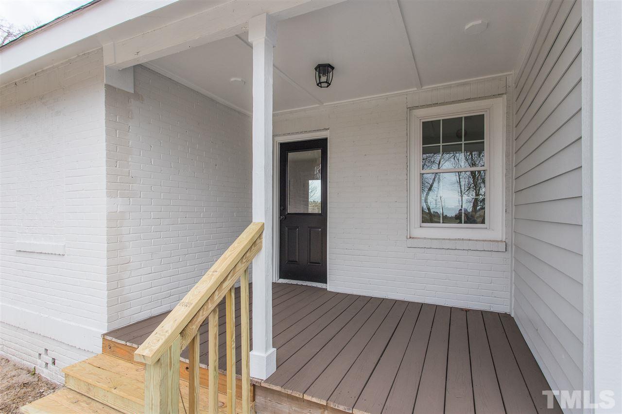 937 Wilson Road Clinton, NC 28328 - Photo 7 of 28 a view of a hallway with wooden floor and staircase