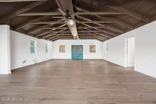a bathroom with a sink toilet a mirror and shower