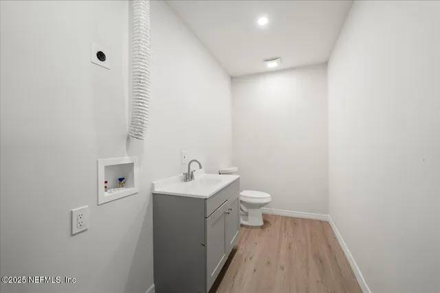 a view of a deck with wooden floor and city view