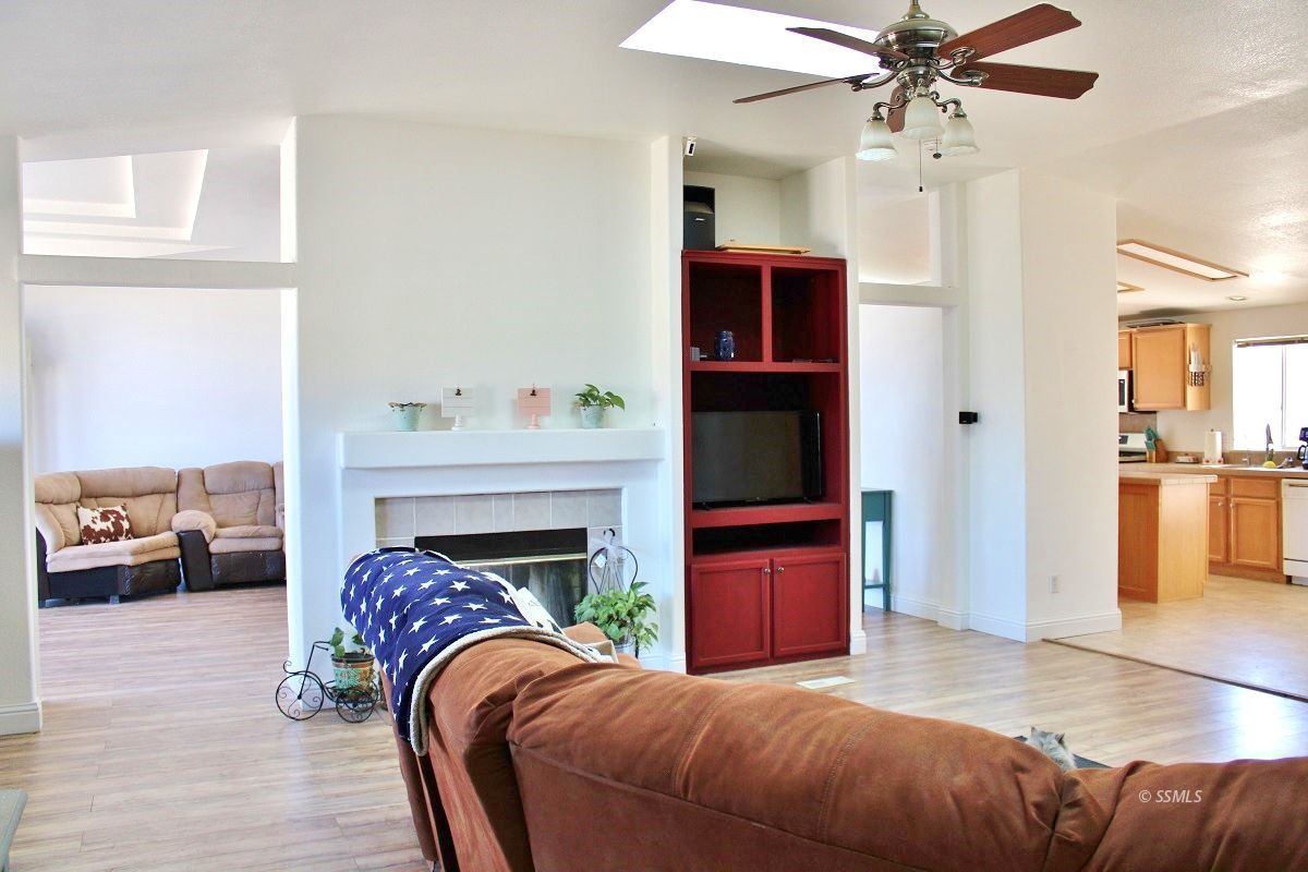 10158 Hillview Acres Road Weldon, CA 93283 - Photo 9 of 45 a living room with furniture and a fireplace