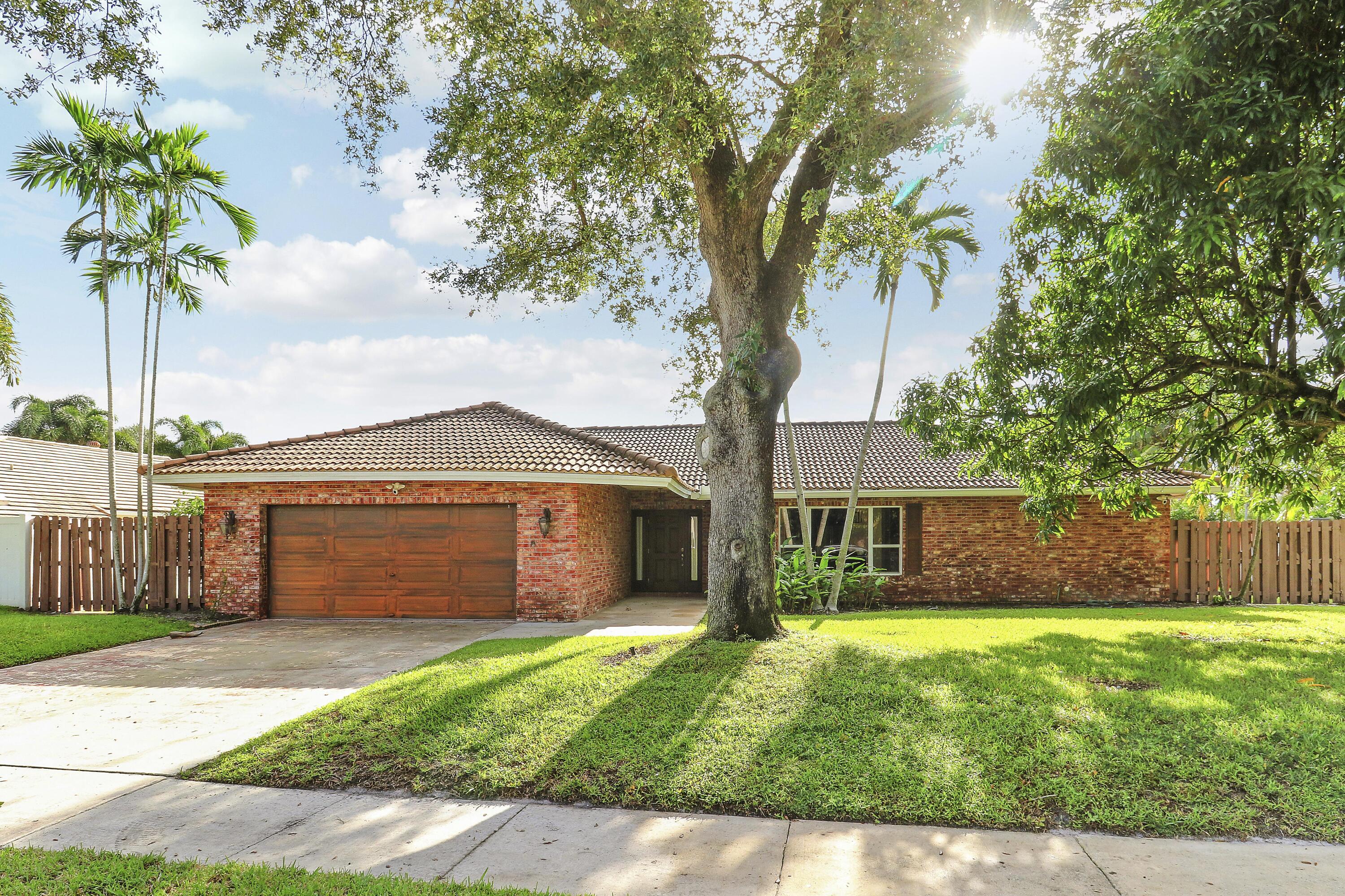 100 Southwest 15th Court Boca Raton, FL 33486 - Photo 1 of 41 front exterior