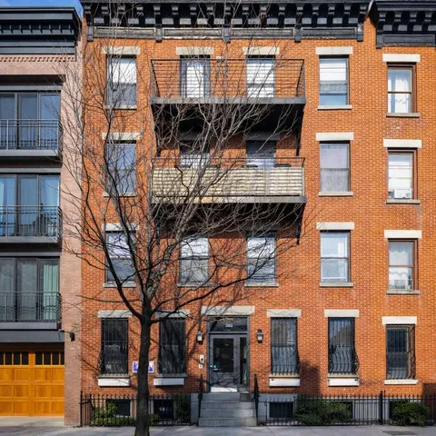 a bathroom with a sink toilet and mirror