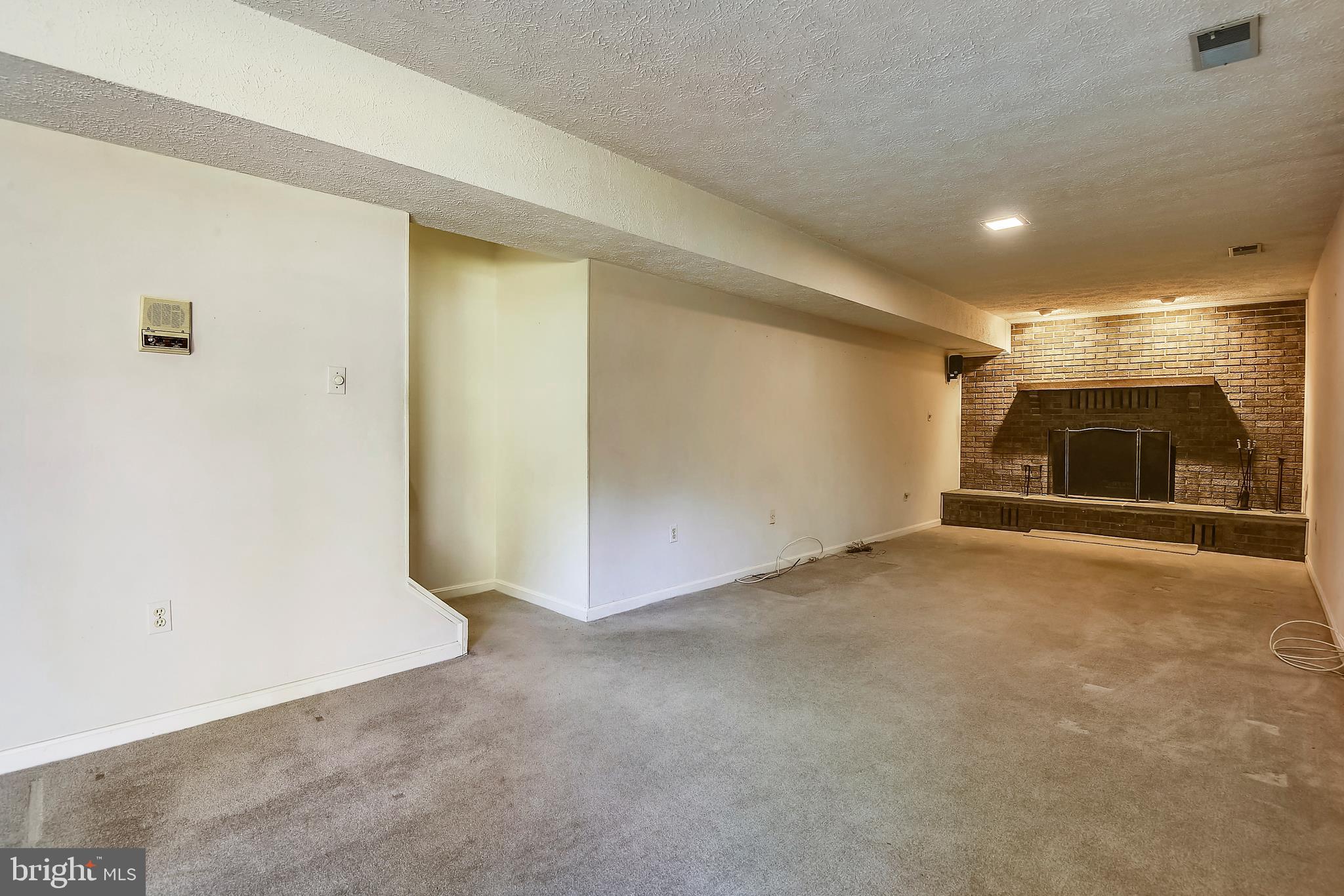 109 Farmgate Lane Silver Spring, MD 20905 - Photo 33 of 50 Finished lower level rec room with fireplace #2