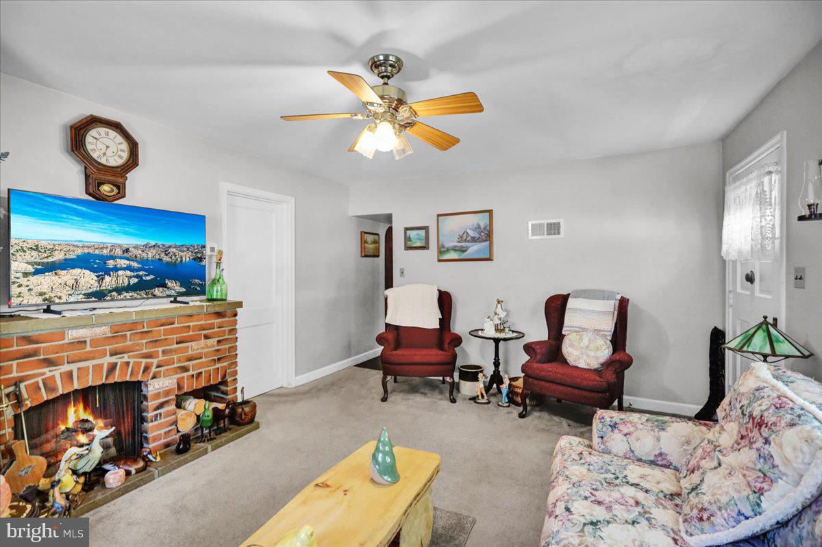 1717 Friedensburg Road Reading, PA 19606 - Photo 16 of 63 a living room with furniture and a fireplace