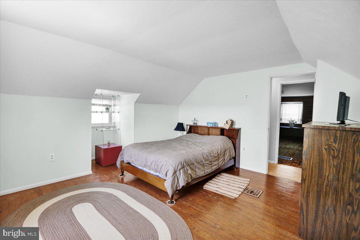 1717 Friedensburg Road Reading, PA 19606 - Photo 36 of 63 a bedroom with a bed and wooden floor