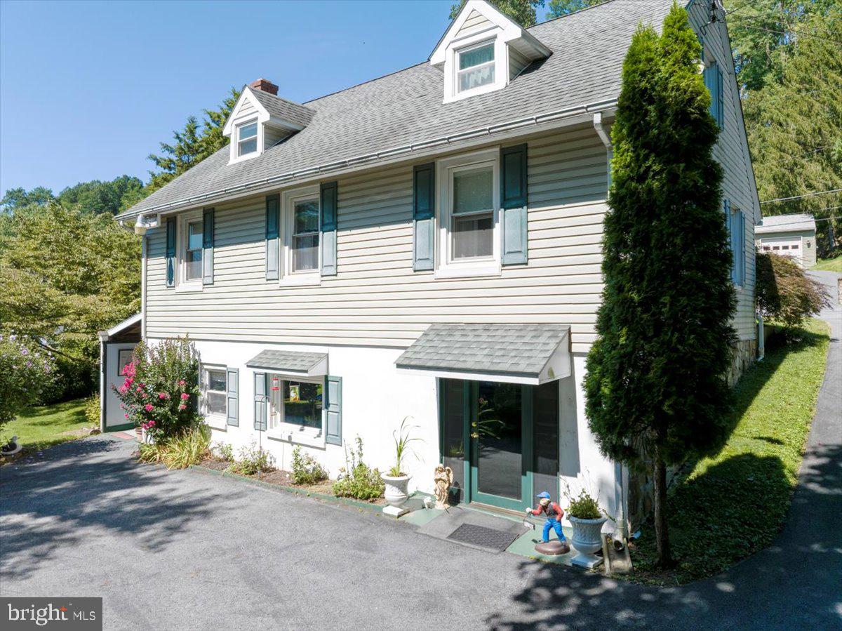 1717 Friedensburg Road Reading, PA 19606 - Photo 47 of 63 a view of a white house with large windows and large tree