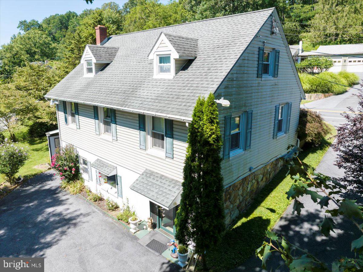 1717 Friedensburg Road Reading, PA 19606 - Photo 48 of 63 a aerial view of a house with a yard and potted plants