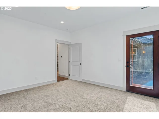 a bathroom with a granite countertop bathtub sink double and mirror