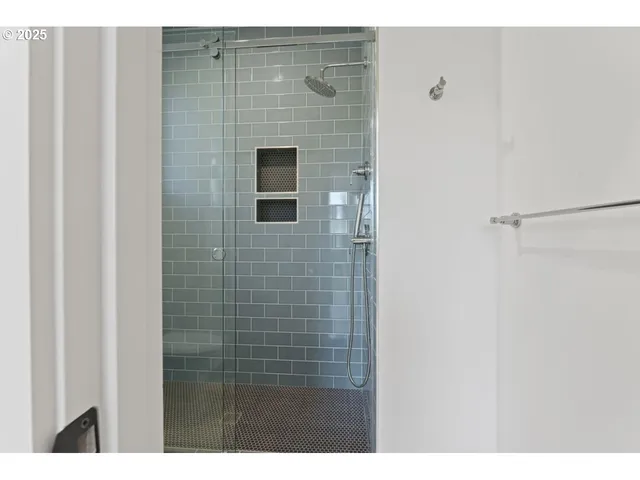 a view of kitchen with cabinets