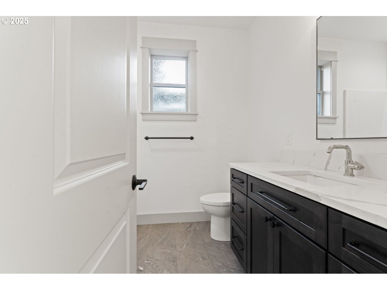 5216 Dunewood Drive Florence, OR 97439 - Photo 29 of 46 a bathroom with a granite countertop sink toilet a mirror and a shower