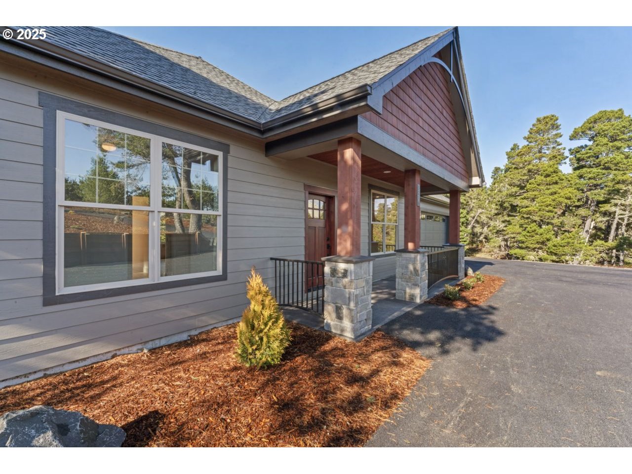 5216 Dunewood Drive Florence, OR 97439 - Photo 3 of 46 a backyard of a house with table and chairs