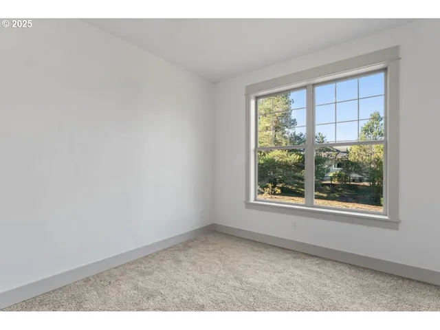 a view of an empty room with windows