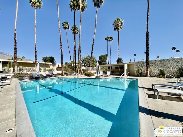 a view of a park with swings and slides