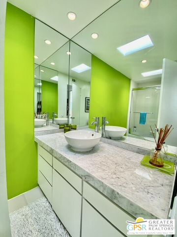 a kitchen with sink and cabinets