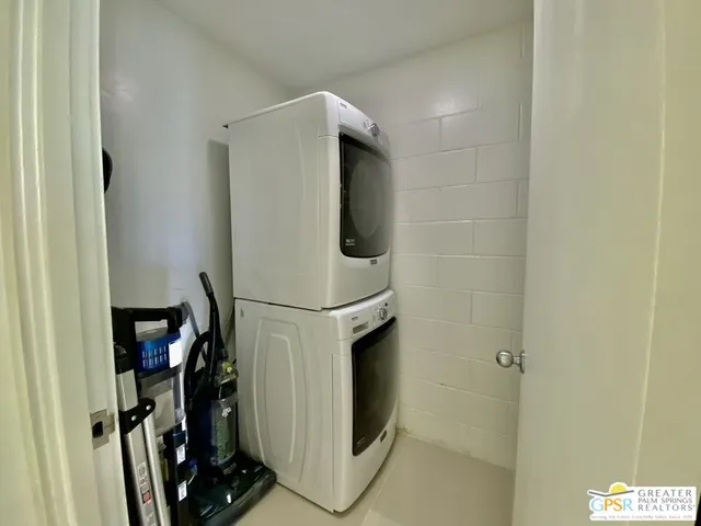 a spacious bedroom with a bed and a couch