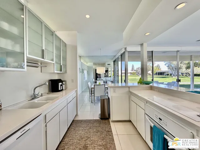 a bedroom with a bed chair and window
