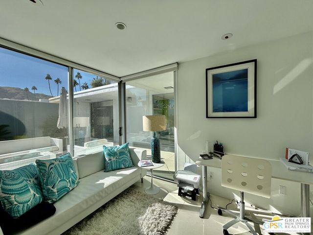 a bathroom with a granite countertop sink a mirror a shower and a bathtub