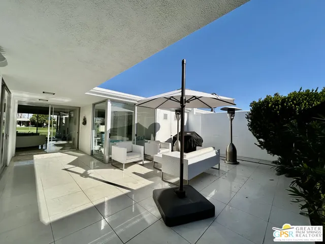 a bedroom with a bed window and a flat screen tv