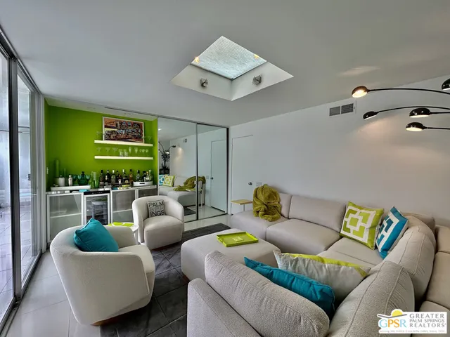 a kitchen with stainless steel appliances granite countertop a sink and a refrigerator