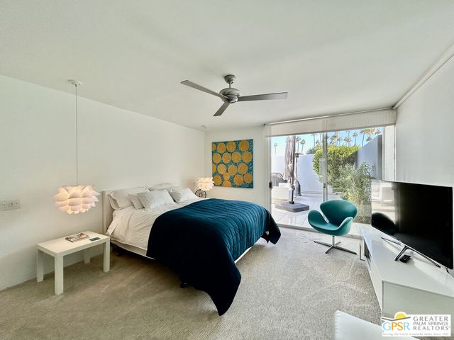 a large kitchen with stainless steel appliances granite countertop a lot of counter space and wooden floor