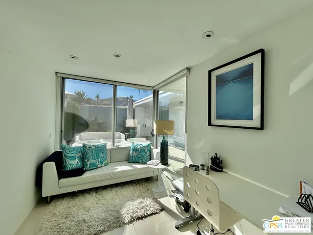 a kitchen with stainless steel appliances kitchen island granite countertop a refrigerator and a sink