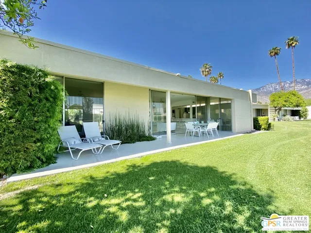 a tall building with trees in front of it